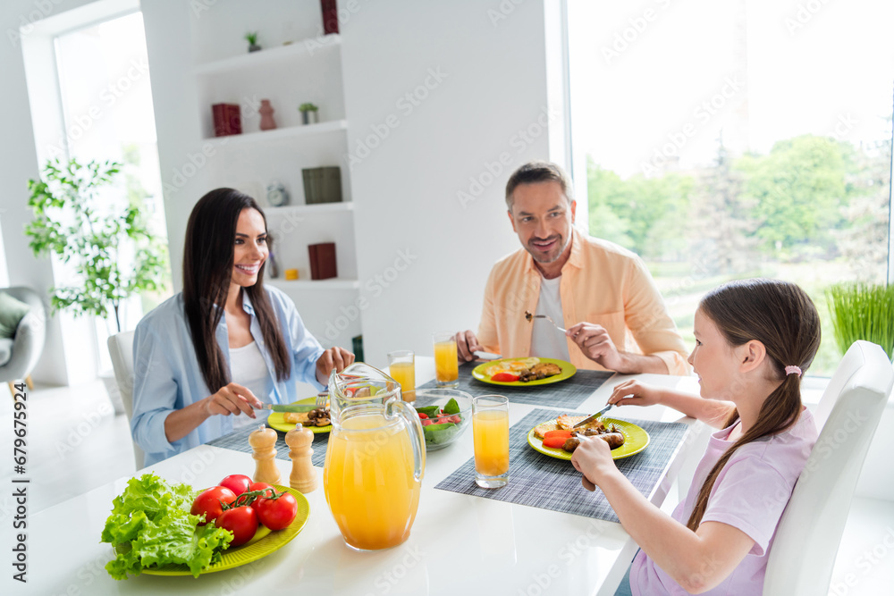 Wall mural portrait of friendly idyllic people sit table eat homemade food speak say tell cozy atmosphere apart