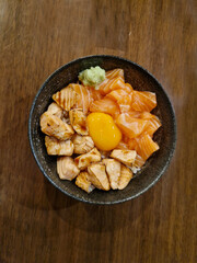 Salmon Donburi Japanese Food,  Grilled and Fresh Salmon Don with Pickled Egg Yolk in Soy Sauce.