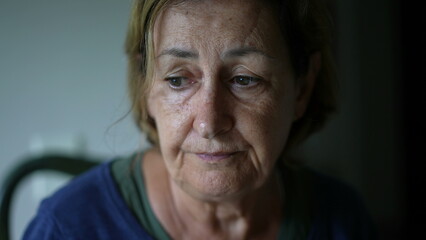 Sad senior woman close-up face in melancholy, expressive contemplative older caucasian lady...