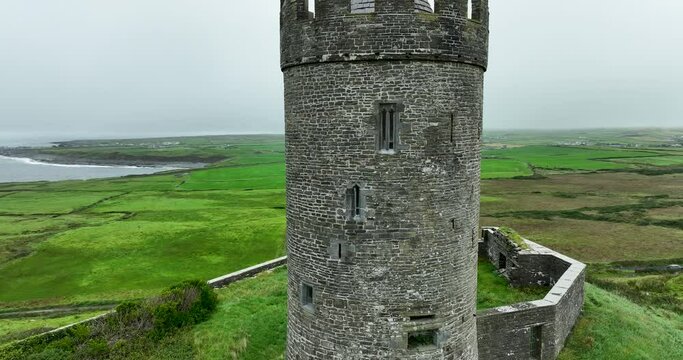 Stone Castle tower surrounded by grass meadows in Clare County 4k
