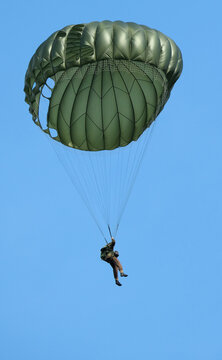 Victory Show. Leicester, UK. Renacted parachute jump with round military style parchutes. 
