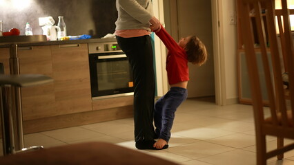 Toes and Tunes - Candid Mother and Son Dancing in Kitchen-Living Room