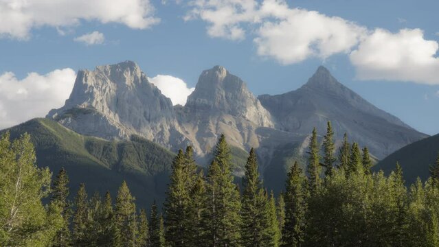 Clouds moving over Three Sisters mountain near Canmore, Alberta, Canada. Timelapse. 