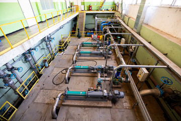 Electric pumps in a wastewater treatment facility - obrazy, fototapety, plakaty