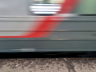 Close-up of a train moving on the street in motion blur