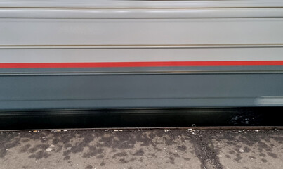 Fototapeta premium Close-up of a train moving on the street in motion blur