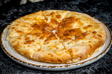 Cheese-Filled Garlic Bread Delight - Close-up of Irresistible Gourmet Indulgence. Image ideal for food enthusiasts, menus, or any design project.