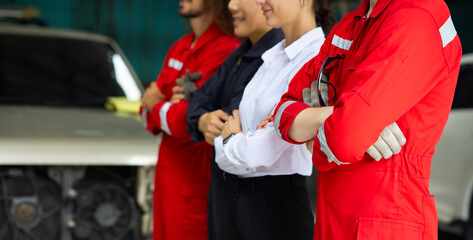 Professional team working at workplace. Unity and teamwork concept. Portrait engineer and mechanic repair factory worker and mechanic team together in factory workplace. Diverse man and woman