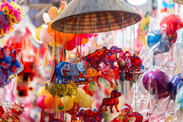 People visit and buy colorful traditional lanterns hanging on Luong Nhu Hoc Street in Vietnam