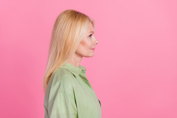 Profile side photo of retired charming confident lady look offer proposition empty space isolated on pink color background