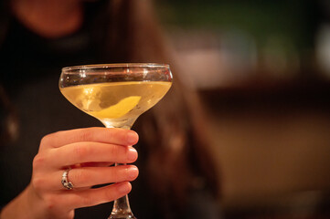 person holding a glass of champagne