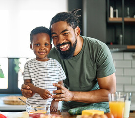 child family kitchen food boy son father breakfast happy together fun morning bonding healthy diet eating home black african american man happy kid game childhood cute parent preparing - Powered by Adobe