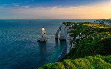 white chalk cliffs and arch in the sunrise  - obrazy, fototapety, plakaty