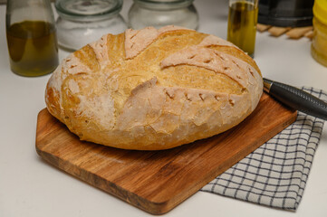 freshly baked homemade bread on the kitchen table on a light background 2