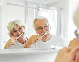 woman tooth bathroom toothbrush hygiene senior morning routine brushing toothpaste care dental...