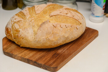 freshly baked homemade bread on the kitchen table on a light background 12
