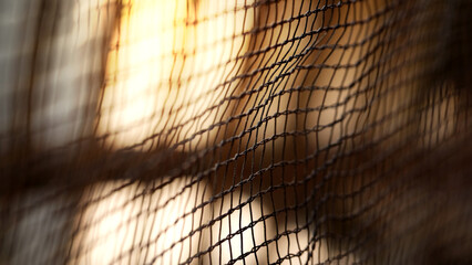 Abstract background of metal netting, close-up, selective focus