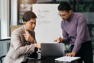 Young Asian business team creative businesspeople coworker in office. Meeting Presentation for analysis graph company financial. People Work in Business Office.