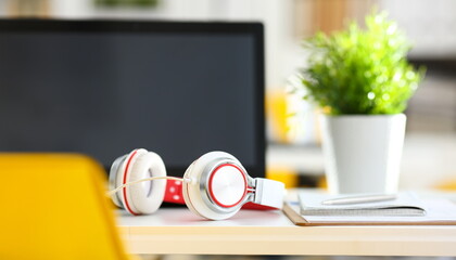 Empty remote office workplace with laptop pc and headset closeup. Receptionist or secretary of...