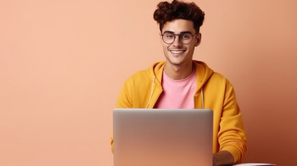 Smiling cheerful smart manwearing casual teenage clothes using laptop computer pose looking at camera isolated color background
