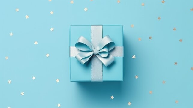 A nice gift box decorated craft papper with a bow on blue background. New Year, Christmas, birthday, Valentines Day, World Womans Day, Fathers Day. top view