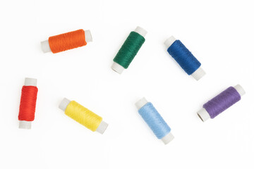Colorful spools of thread isolated on a white background