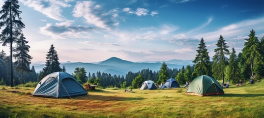 Idyllic campsite in the majestic mountains tent in the foreground on a sunny summer day - obrazy, fototapety, plakaty