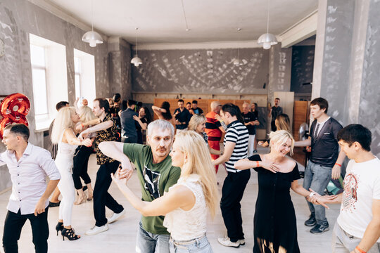 Kharkiv, Ukraine 11.09.23 Guy and girl are dancing bachata on dance floor. Social Latin American event.