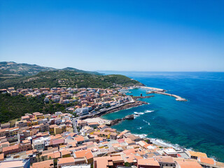 Naklejka na ściany i meble Castelsardo harbor during summer. Famous destination on the Italian island of Sardinia.