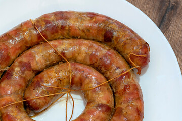 baked sausage. Homemade Pork sausage. Homemade sausage on the plate