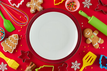 Christmas treats bring joy. Top view photo of cookies, baking utensils, bowl, baking molds,...