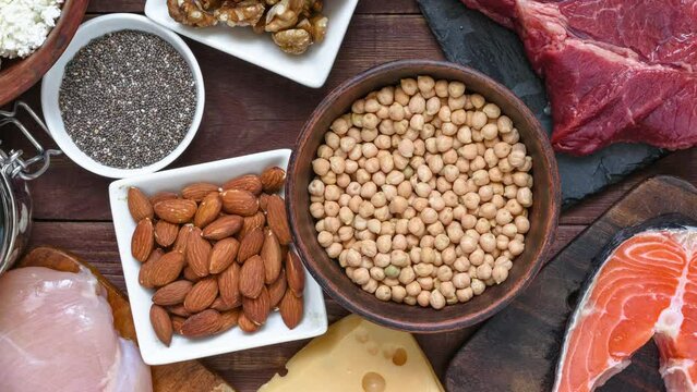 High protein food. Fish, meat, poultry, nuts, eggs, seeds and dairy products. Healthy eating and balanced food concept. Keto and low carb diet. Top view