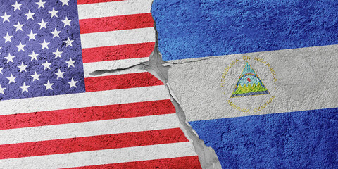 USA and Nicaragua flags on a stone wall with a crack, illustration of the concept of a global...