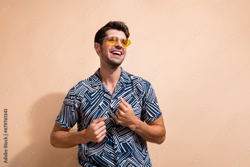 Poster photo of optimistic cheerful good mood man dressed stylish clothes looking empty space isolated on b