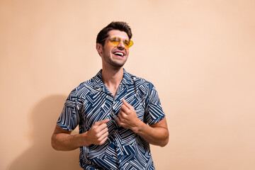 Photo of optimistic cheerful good mood man dressed stylish clothes looking empty space isolated on...