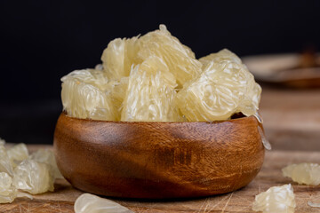 peeled pomelo on the table, close up