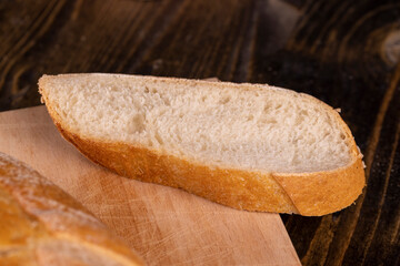 wheat loaf of bread close-up on the table