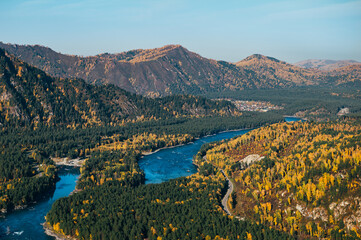 Autumn October Landscape in Altai region, Russian republic in southern Siberia, Russia, with winding blue Katun river and mountains, Aerial top view.