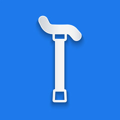 Paper cut Walking stick cane icon isolated on blue background. Paper art style. Vector