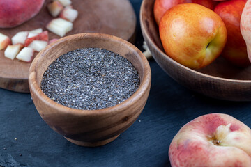 raw chia seeds rich in vitamins and minerals , wooden bowl