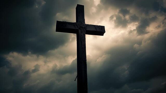 Closeup of a Cemetery Cross, standing tall against a dramatic stormy sky. The crosss silhouette creates a powerful and somber image, reflecting the cycles of life and the inevitability of