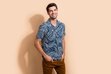 Photo of good mood optimistic man with stylish hairdo dressed print shirt standing keep arms in...