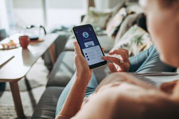 Woman Managing Finances on Banking App with Smartphone