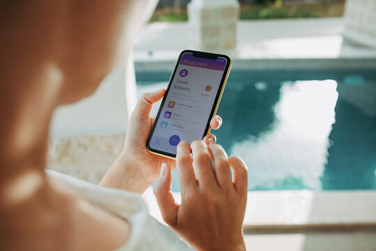 Woman Managing Finances on Banking App with Smartphone