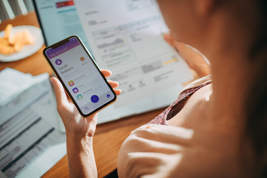 Woman Managing Finances on Banking App with Smartphone