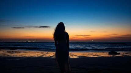 Fototapeta premium clam and peaceful beautiful moment of rear view beautiful woman standing on the beach watching sunset beauty seascape landscape background travel concept