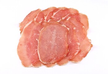 Slices of Lonzino on white background. It is a type of italian salumi  made of cured pork loin. - obrazy, fototapety, plakaty