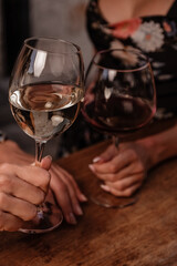 two glasses of wine in female hands