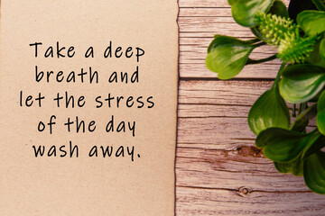 Motivational and inspirational quote on burnt edge brown paper on wooden desk