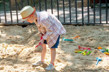 Child on playground in summer park